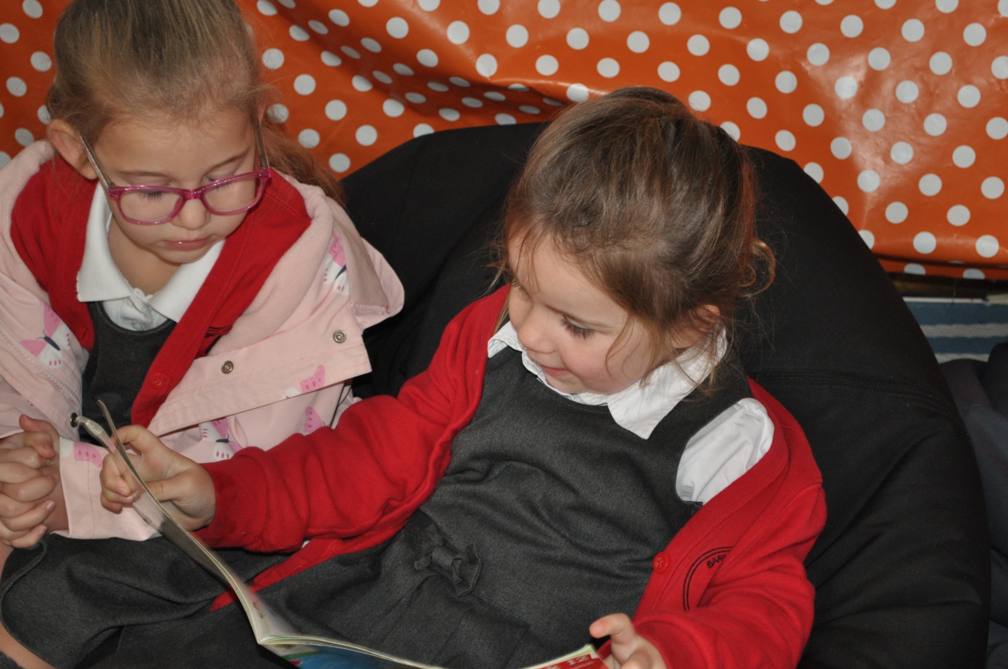School girl reading a book